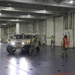 Soldiers and Marines load equipment aboard the U.S.N.S. Watkins (T-AKR 315) while moored at Wharf Alpha on Joint Base Charleston, South Carolina