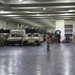 Soldiers and Marines load equipment aboard the U.S.N.S. Watkins (T-AKR 315) while moored at Wharf Alpha on Joint Base Charleston, South Carolina