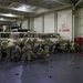 Soldiers and Marines load equipment aboard the U.S.N.S. Watkins (T-AKR 315) while moored at Wharf Alpha on Joint Base Charleston, South Carolina