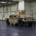 Soldiers and Marines load equipment aboard the U.S.N.S. Watkins (T-AKR 315) while moored at Wharf Alpha on Joint Base Charleston, South Carolina