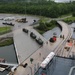 Soldiers and Marines load equipment aboard the U.S.N.S. Watkins (T-AKR 315) while moored at Wharf Alpha on Joint Base Charleston, South Carolina