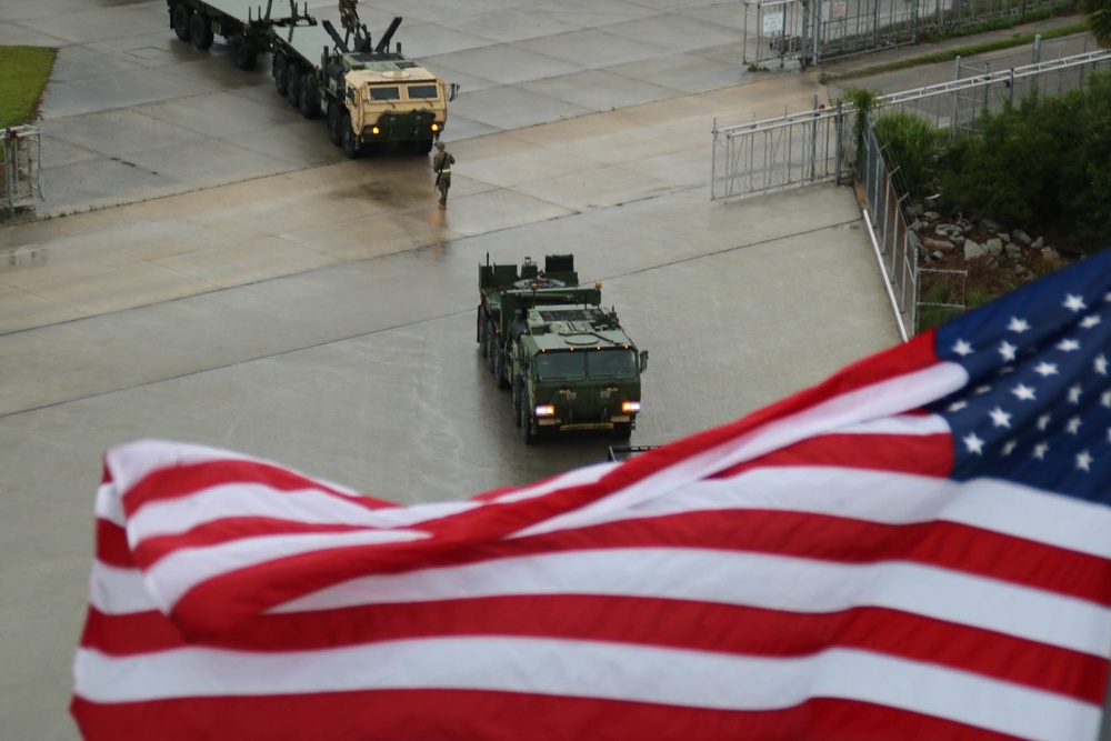 Soldiers and Marines load equipment aboard the U.S.N.S. Watkins (T-AKR 315) while moored at Wharf Alpha on Joint Base Charleston, South Carolina