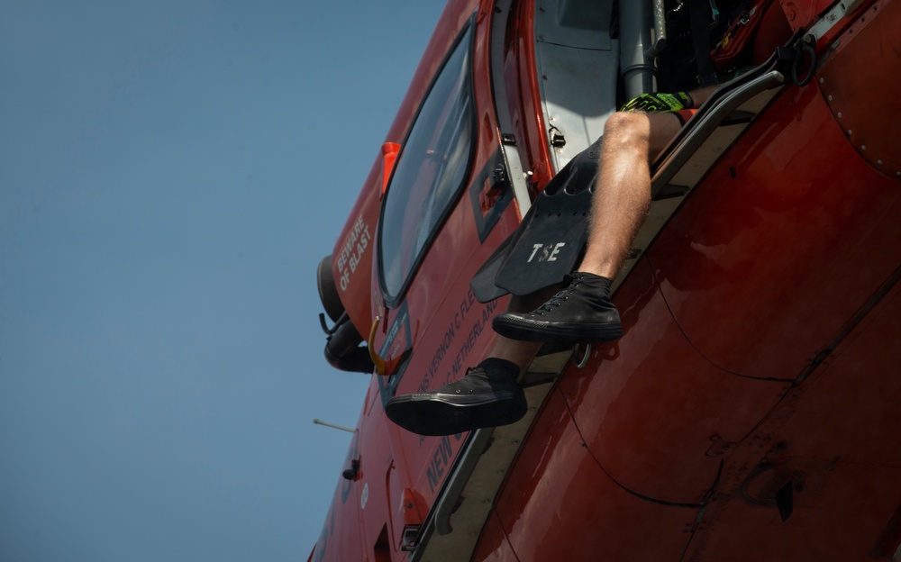 Coast Guard members conduct helo op training