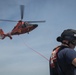 Coast Guard members conduct helo op training