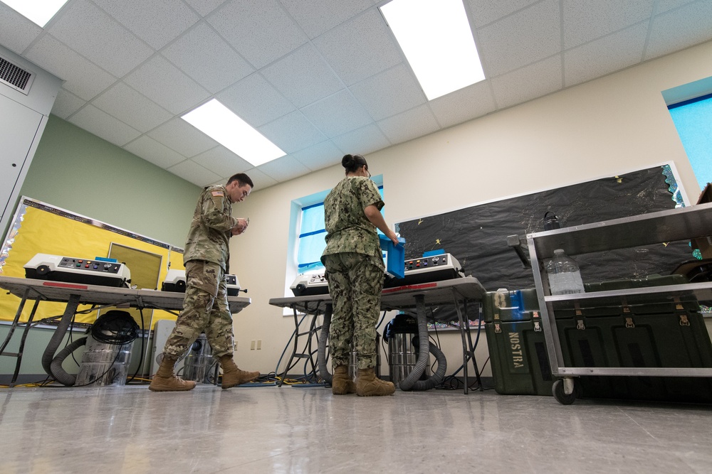 Sailors make no-cost eyeglasses for community during IRT mission