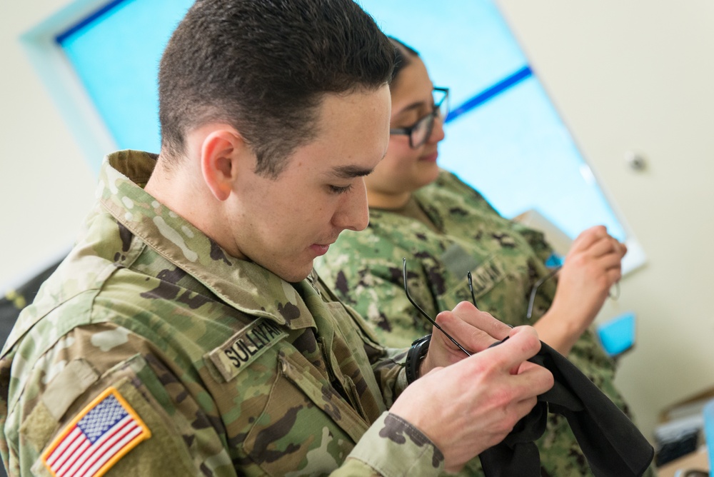 Sailors make no-cost eyeglasses for community during IRT mission