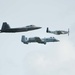 A F-22 Raptor, P-51D Mustang and an A-10 Thunderbolt II fly in a formation at Wings Over Whiteman