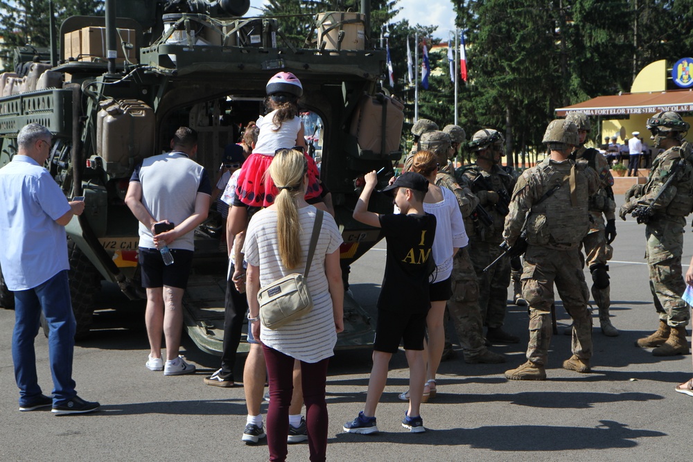 U.S. Soldiers and Romanian civilians in front of ICV at static display in Sibiu, Romania