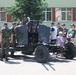Romanian Soldiers and civilians in front of anti-aircraft gun at static display in Sibiu, Romania