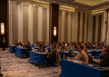 Staff training event participants discuss peacekeeping scenarios during Khaan Quest 2019