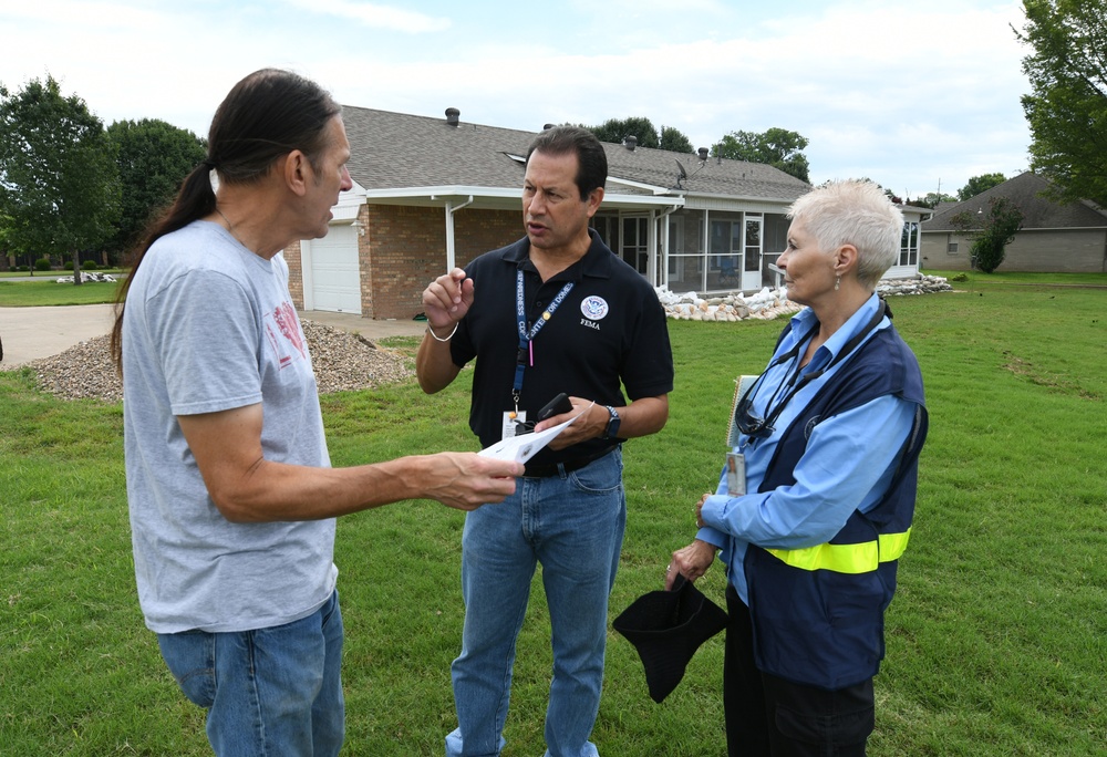 FEMA Disaster Survivor Assistance Members Talk to a Resident in Scott, Arkansas