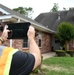 A FEMA Inspector Inspects a House Damaged by Recent Arkansas Flooding