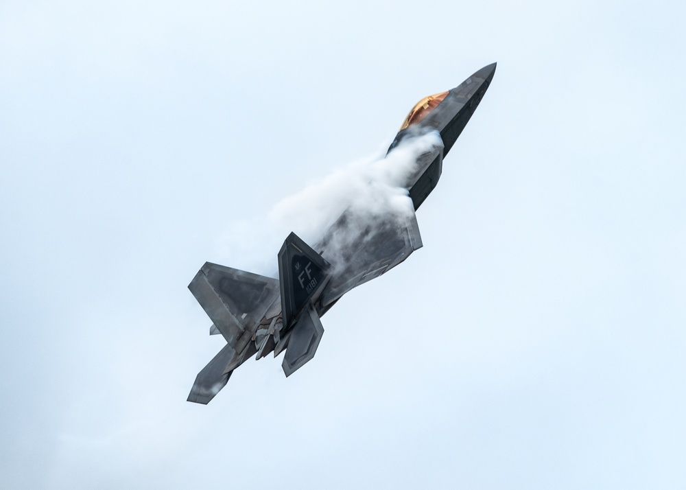 An Air Force F-22 Raptor performs at the Wings Over Whiteman Air and Space Show