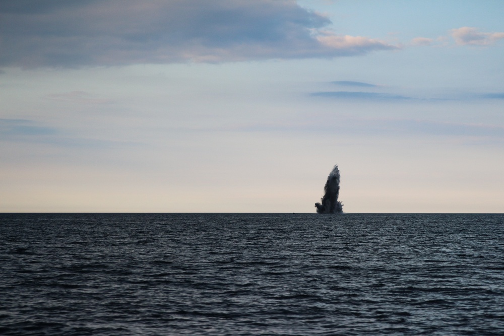 HDMS Soloven (P563), Flyvefisken-class PV, anchors in the Baltic Sea during underwater detonations conducted by Norwegian, Belgian and U.S. forces.