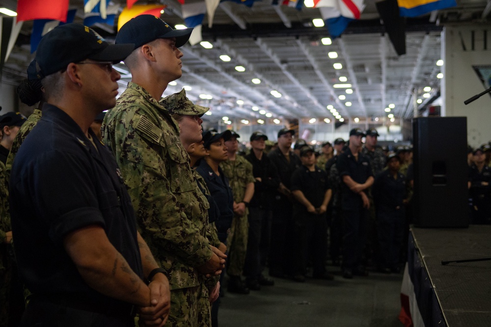 The aircraft carrier USS John C. Stennis (CVN 74) hosts an all-hands call