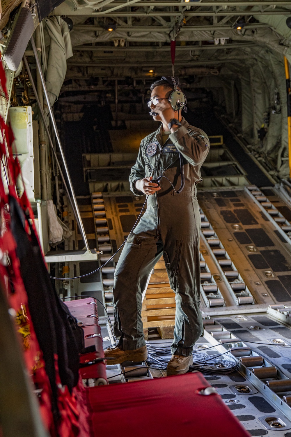 U.S. Marine Corps KC-130 Hercules refuel Canadian aircraft in the air