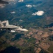 U.S. Marine Corps KC-130 Hercules refuel Canadian aircraft in the air