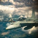 U.S. Marine Corps KC-130 Hercules refuel Canadian aircraft in the air