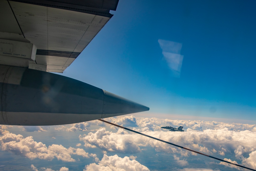 U.S. Marine Corps KC-130 Hercules refuel Canadian aircraft in the air