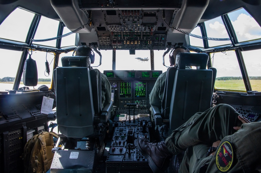 U.S. Marine Corps KC-130 Hercules refuel Canadian aircraft in the air