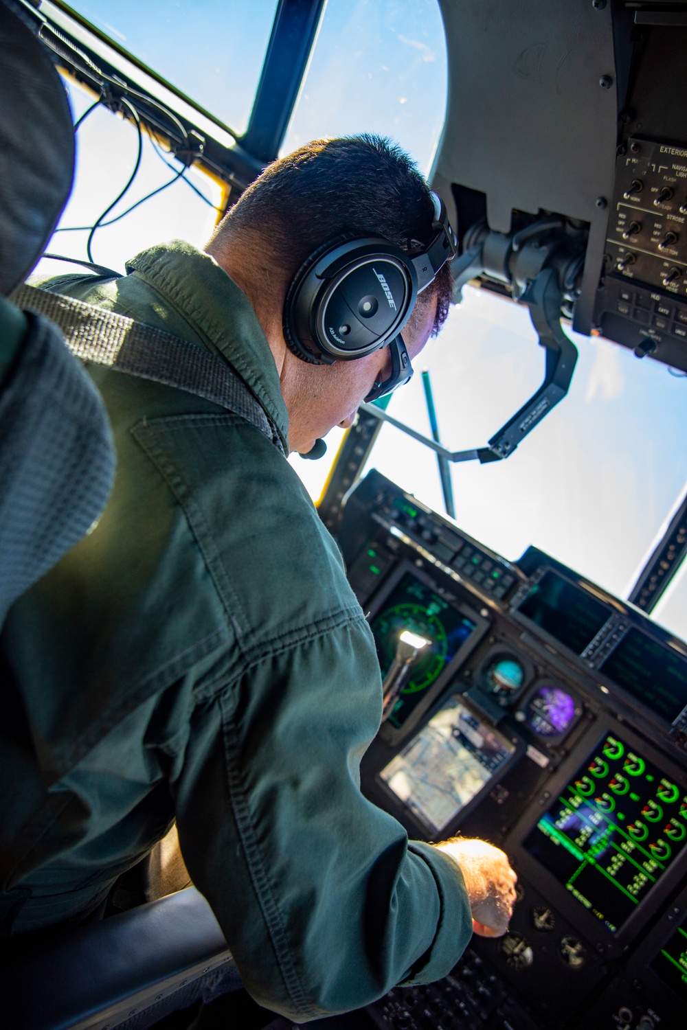 U.S. Marine Corps KC-130 Hercules refuel Canadian aircraft in the air