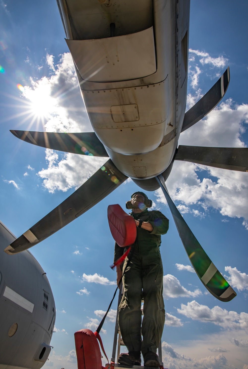 U.S. Marine Corps KC-130 Hercules refuel Canadian aircraft in the air