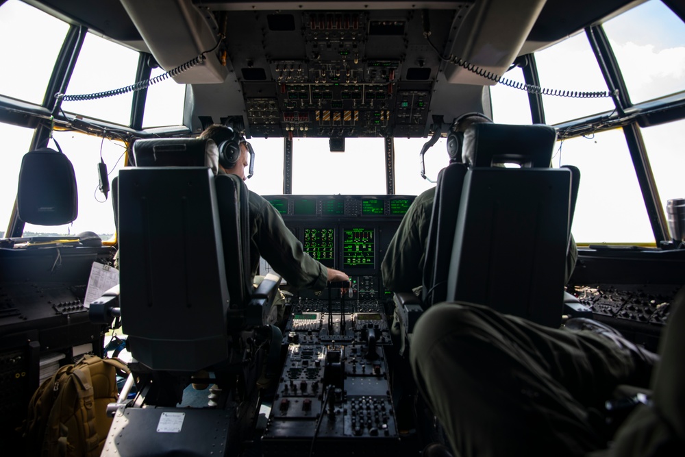 U.S. Marine Corps KC-130 Hercules refuel Canadian aircraft in the air