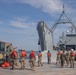 Marines with 2nd Transportation Support Battalion off Load Vehicles of a Trident Pier during Resolute Sun