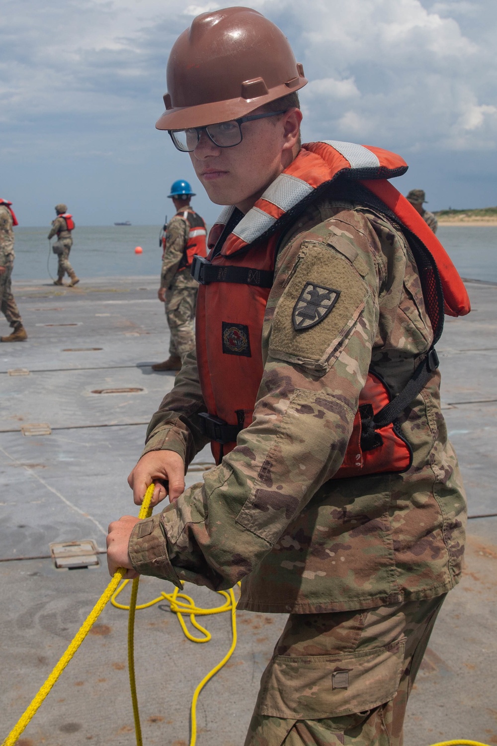 Marines with 2nd Transportation Support Battalion off Load Vehicles of a Trident Pier during Resolute Sun