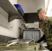 Navy Culinary Specialist Sanitizes Equipment