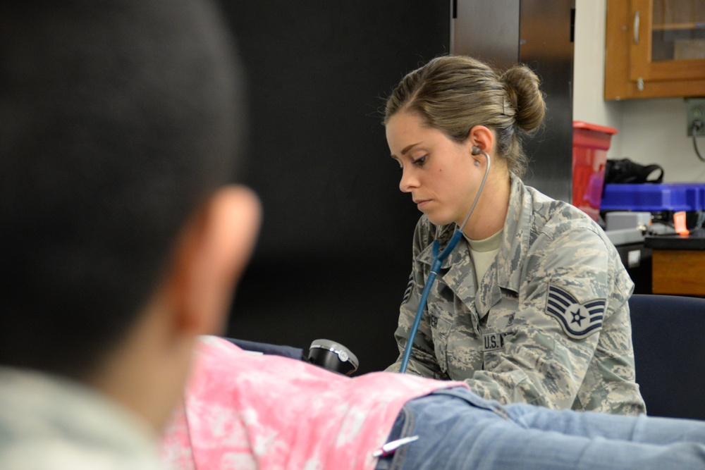 Airman Tests Vitals During IRT Mission