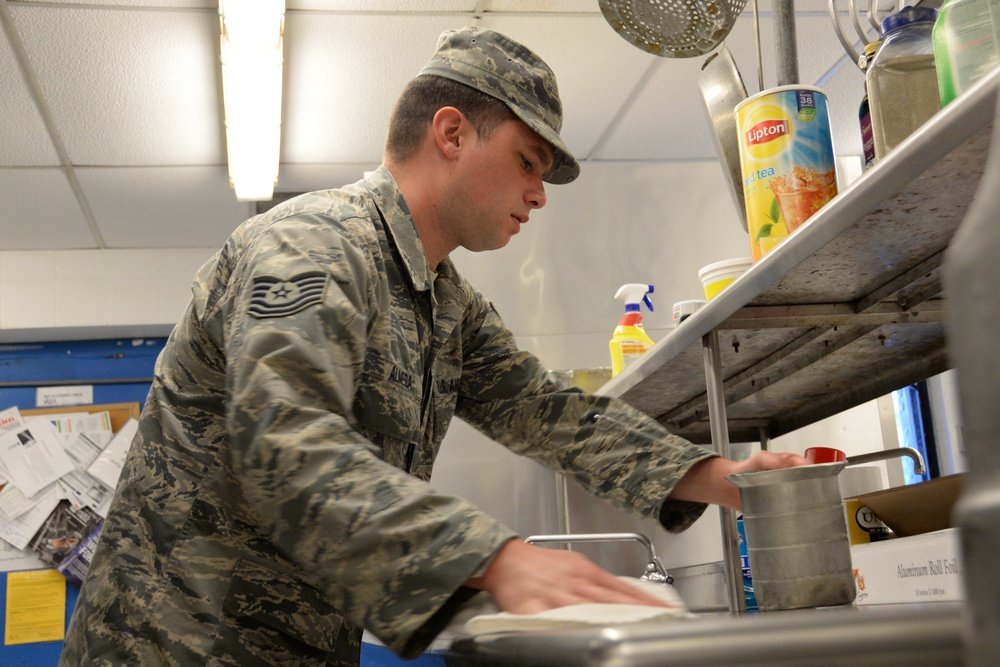 Services Specialist Sanitizes Surface After Meal