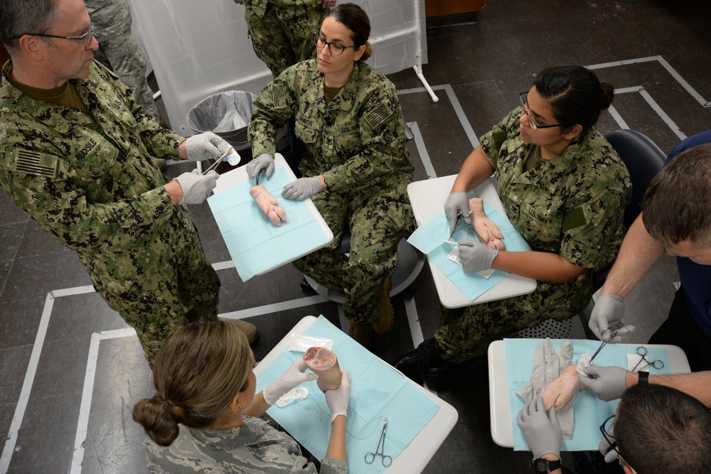 Medical Personnel Practice Suture Techniques During IRT Mission