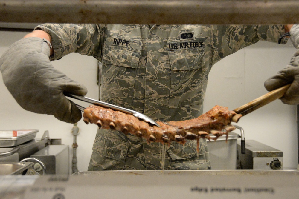 Services Specialist Cook Ribs During IRT Mission