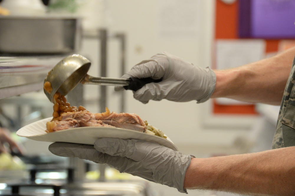 Services Specialist Serves Dinner During IRT Mission