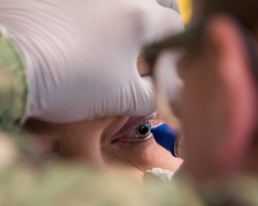 IRT Navy Corpsman Performs Ocular Exam
