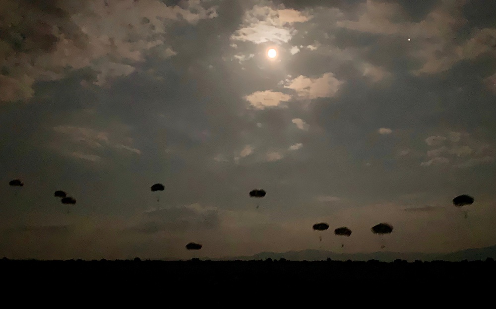 Full moon brings light to paratroopers jumping