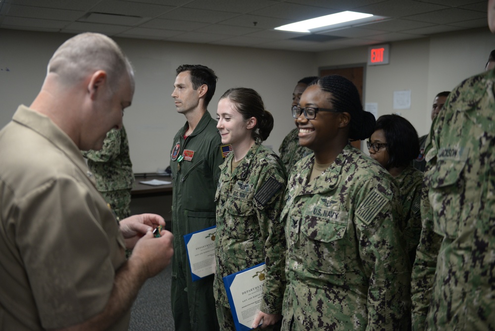 Awards Quarters for deserving Sailors