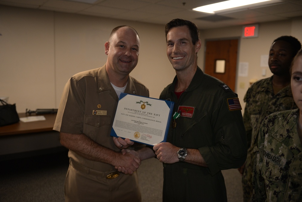 Awards Quarters for deserving Sailors