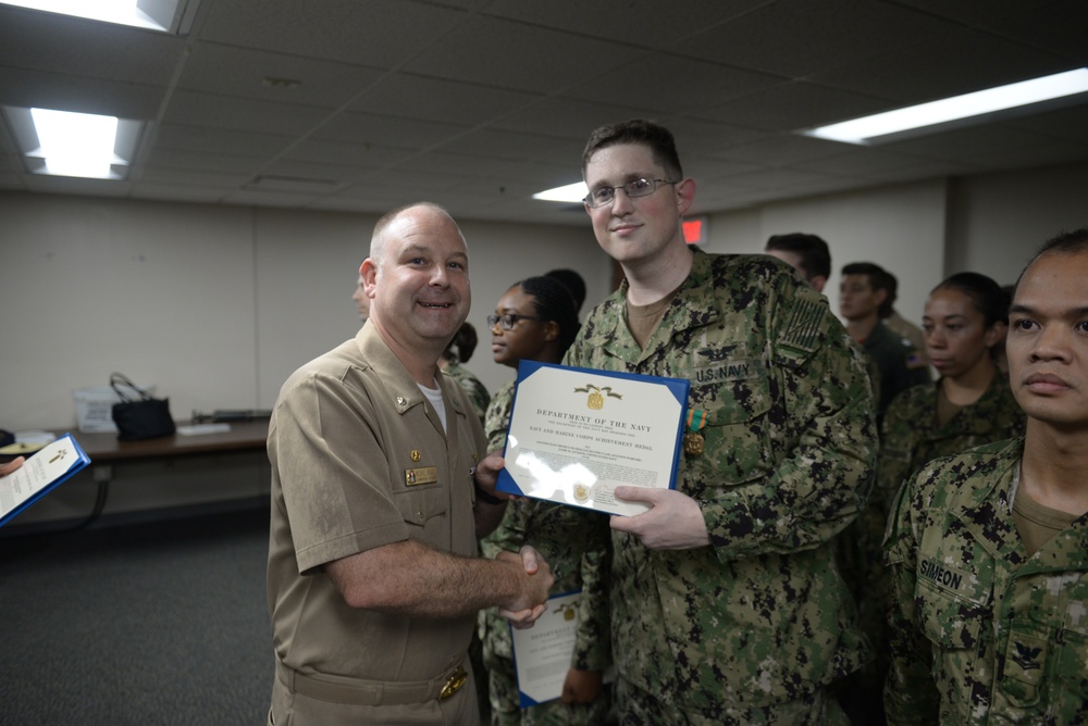 Awards Quarters for deserving Sailors