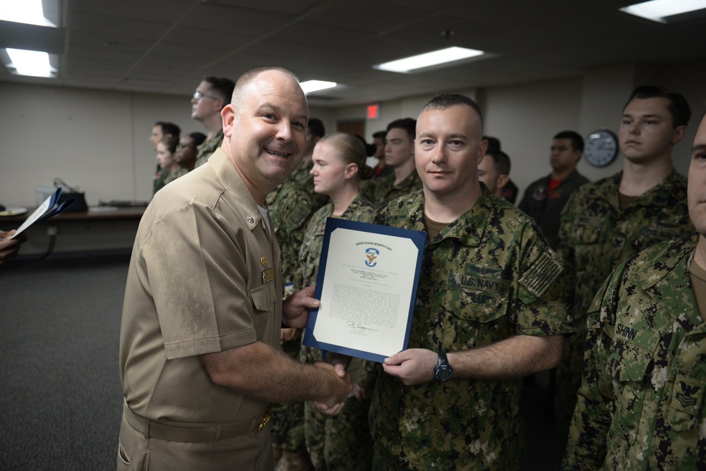 Awards Quarters for deserving Sailors