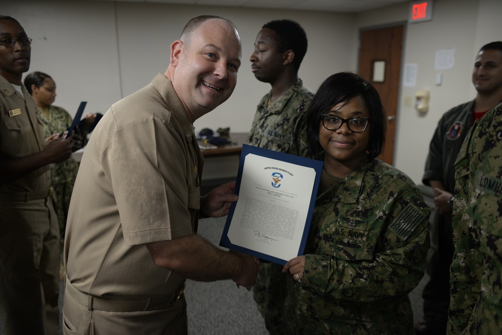 Awards Quarters for deserving Sailors