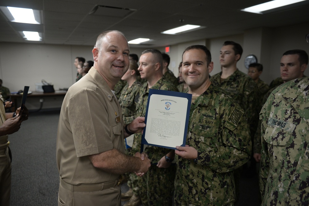 Awards Quarters for deserving Sailors