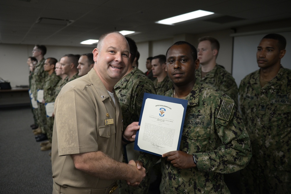 Awards Quarters for deserving Sailors