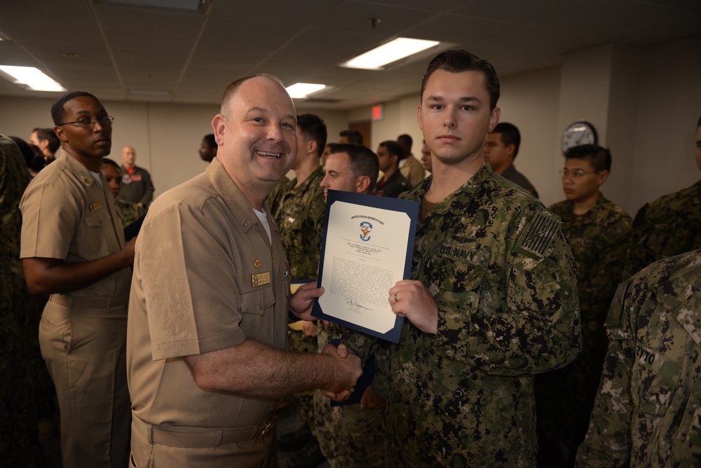 Awards Quarters for deserving Sailors