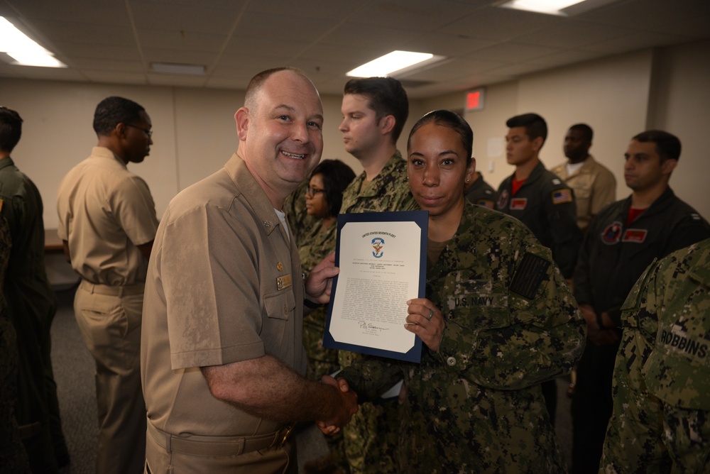 Awards Quarters for deserving Sailors