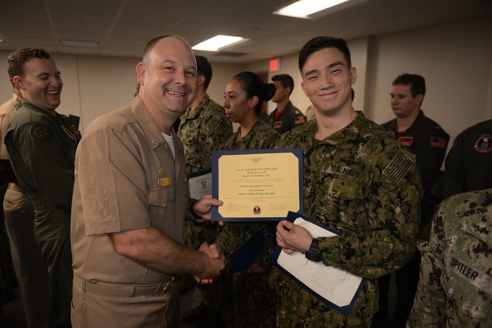 Awards Quarters for deserving Sailors