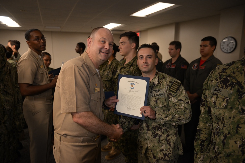 Awards Quarters for deserving Sailors