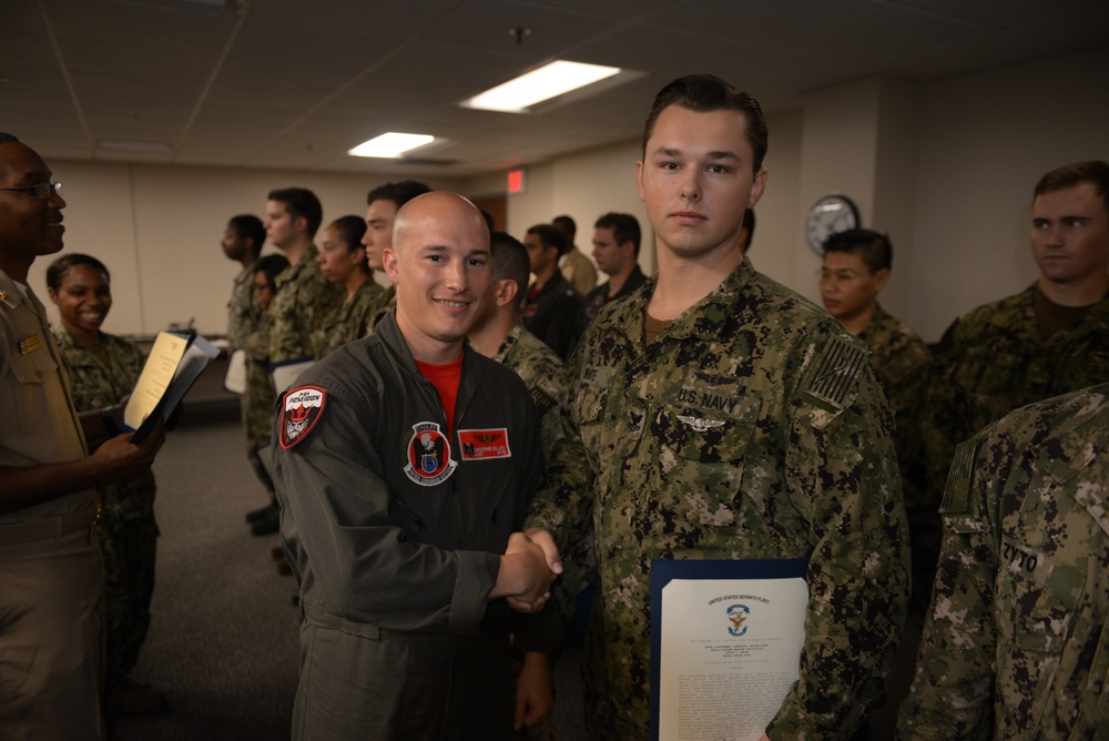 Awards Quarters for deserving Sailors