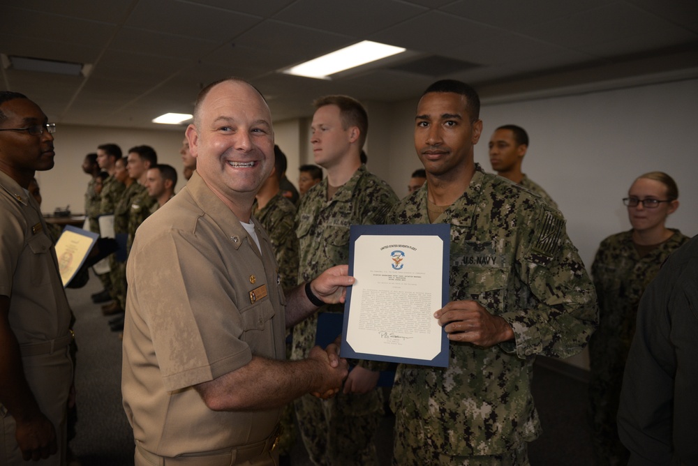 Awards Quarters for deserving Sailors